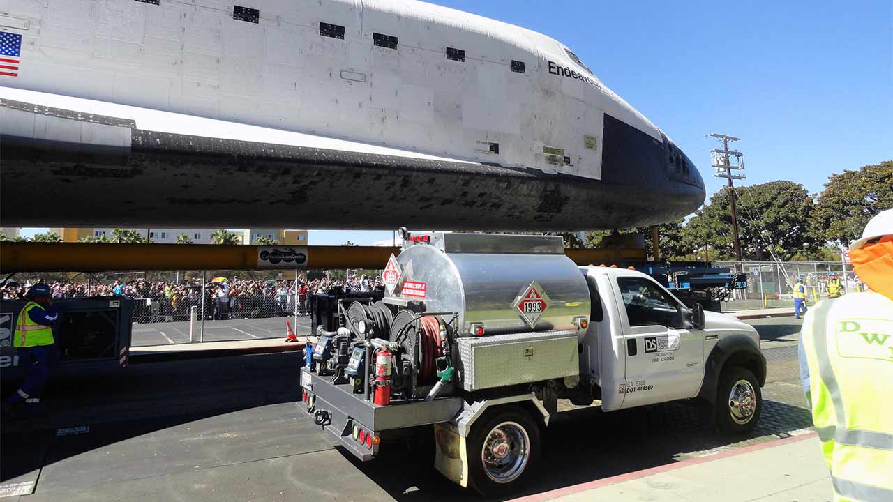 Dion & Sons truck traveled with the shuttle hauler to continuously fuel it during the trip